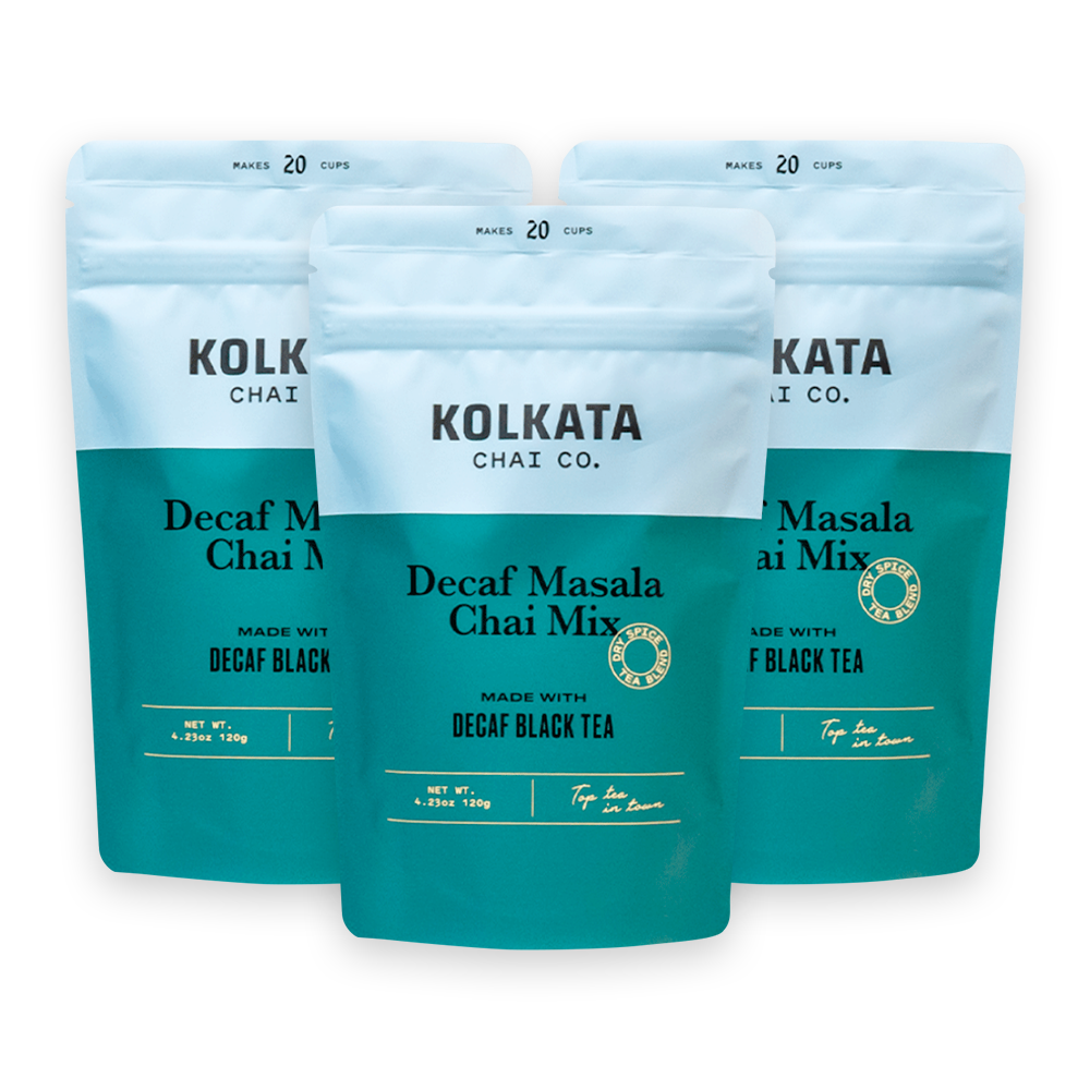 Two boxes of Kolkata Chai Co. Masala Chai Concentrate with a free mug.